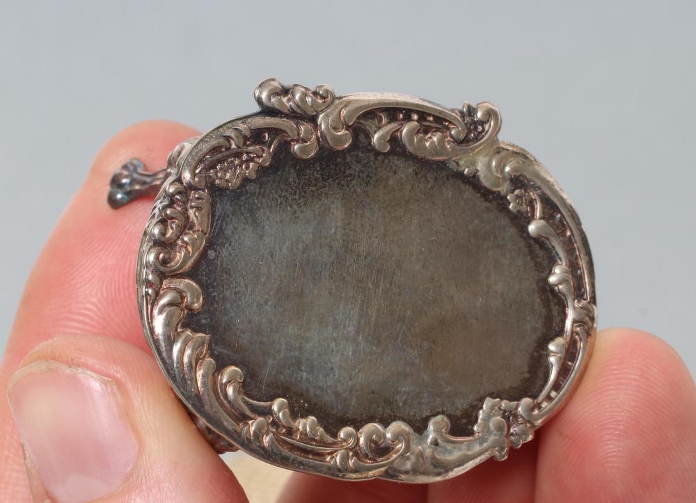 A boxed set of sterling silver doll's house furniture Image