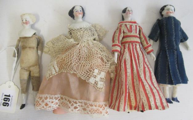 Four miniature dolls Image