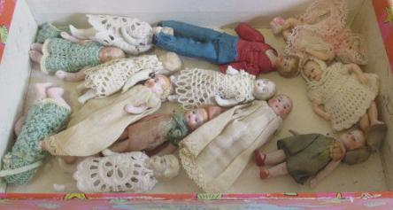 Thirteen doll's house dolls Image