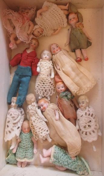 Thirteen doll's house dolls Image