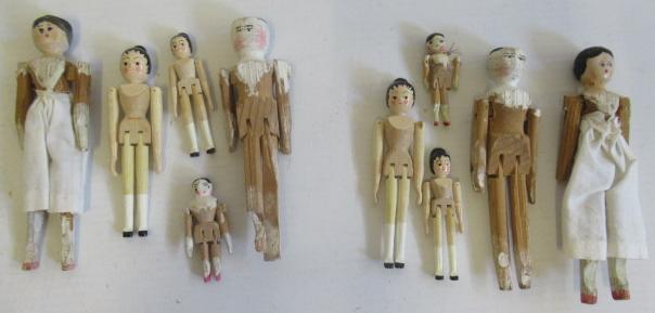 A collection of miniature peg dolls Image