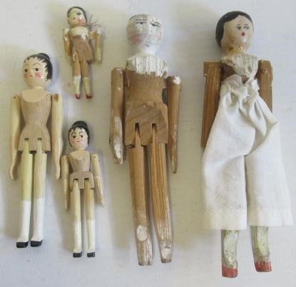A collection of miniature peg dolls Image