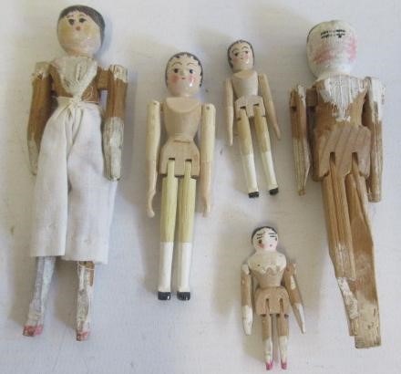 A collection of miniature peg dolls Image