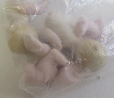 A large quantity of spare parts of miniature and doll's house dolls Image