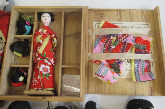 A collection of oriental dolls Image