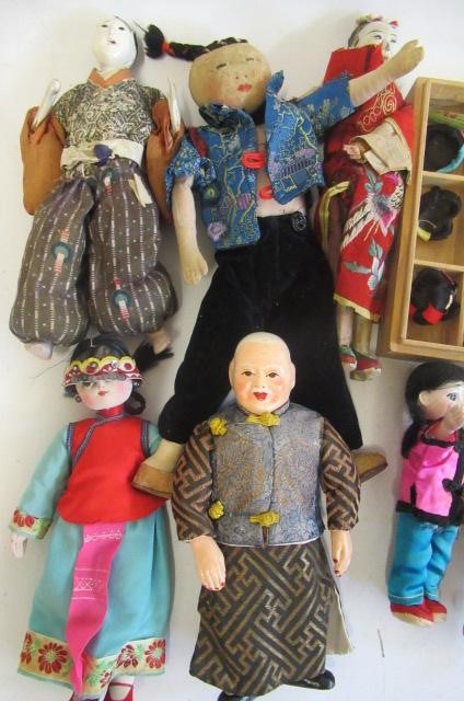 A collection of oriental dolls Image