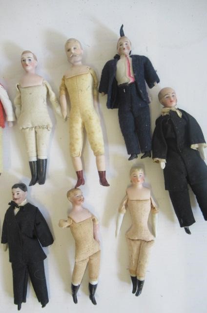 Fifteen bisque shoulder head miniature male dolls Image