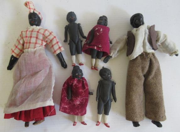 Six all bisque miniature black dolls Image
