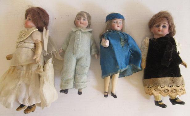 Four miniature dolls Image