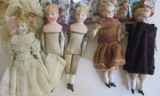 Eight miniature dolls Image