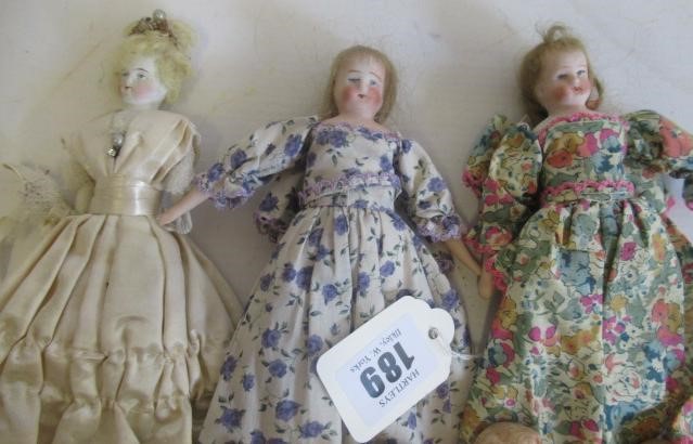 Eight miniature dolls Image