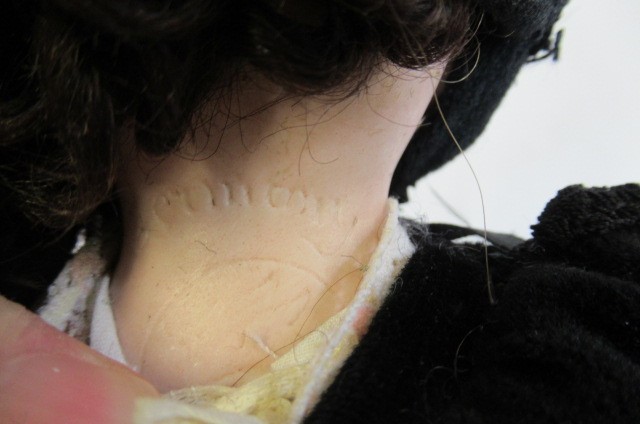 A Cuno & Otto Dressel bisque shoulder head doll Image