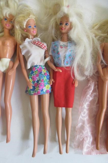 Two boxes of 15 Barbie dolls Image