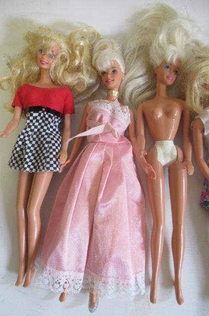 Two boxes of 15 Barbie dolls Image