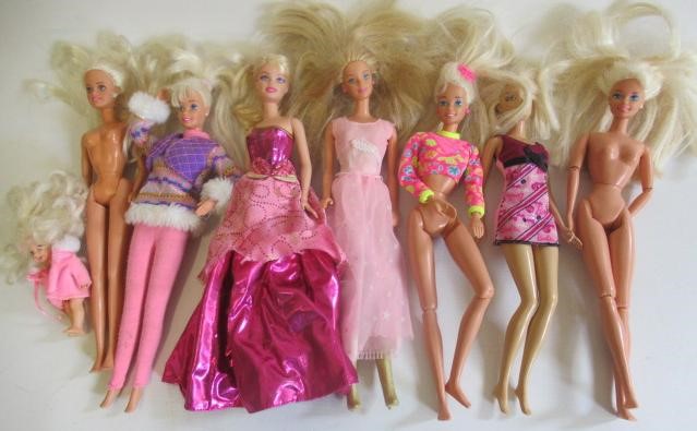 Two boxes of 15 Barbie dolls Image