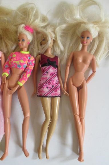 Two boxes of 15 Barbie dolls Image