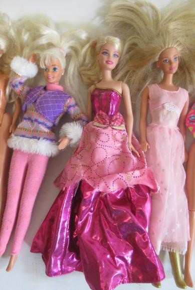 Two boxes of 15 Barbie dolls Image