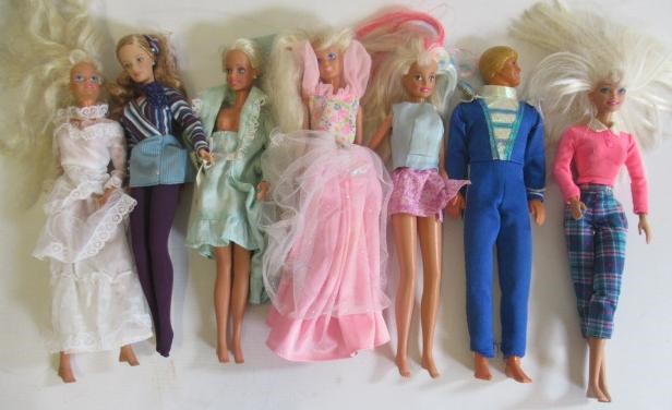 Two boxes of 15 Barbie dolls Image