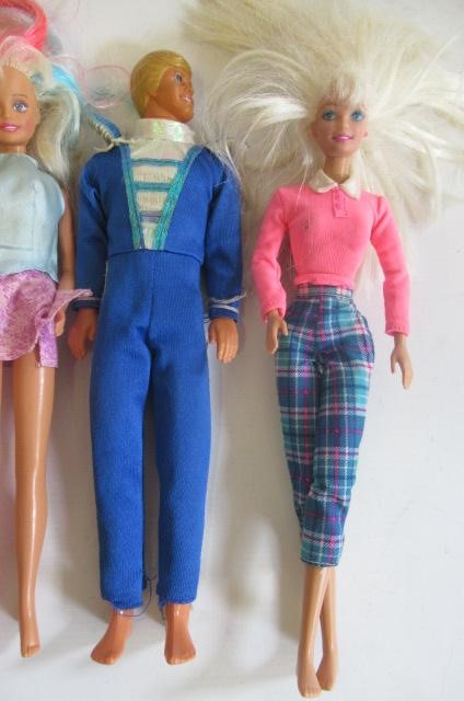 Two boxes of 15 Barbie dolls Image
