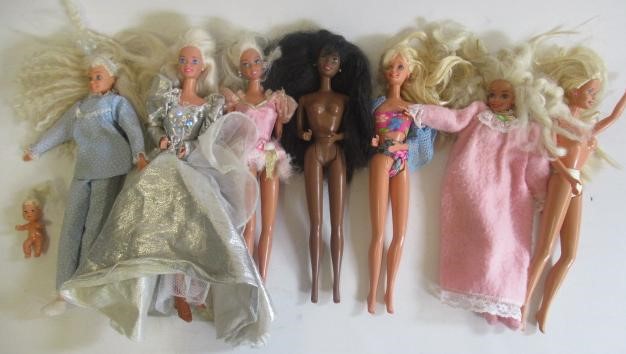 Two boxes of 15 Barbie dolls Image