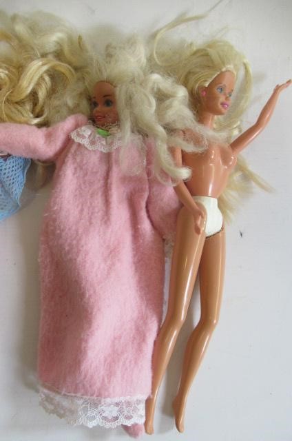 Two boxes of 15 Barbie dolls Image