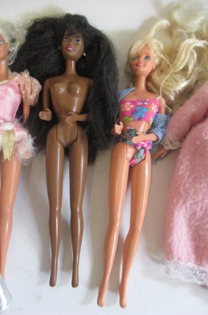 Two boxes of 15 Barbie dolls Image
