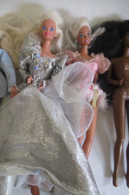 Two boxes of 15 Barbie dolls Image