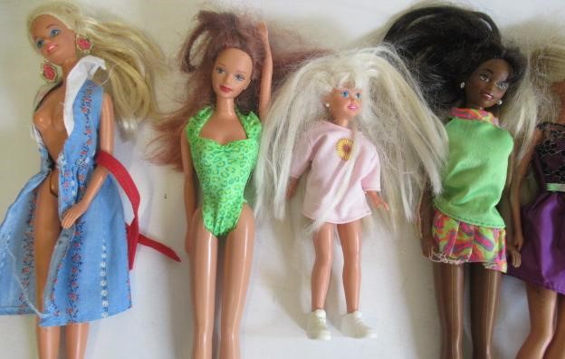 Two boxes of Barbie dolls and accessories Image