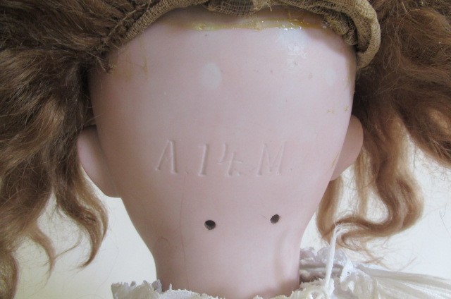 A large Armand Marseille bisque socket head doll Image