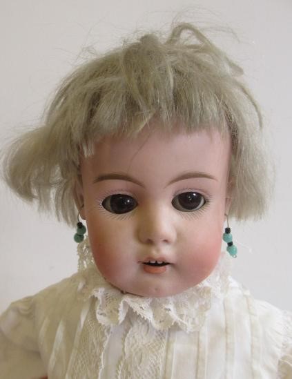 A German bisque shoulder head doll Image