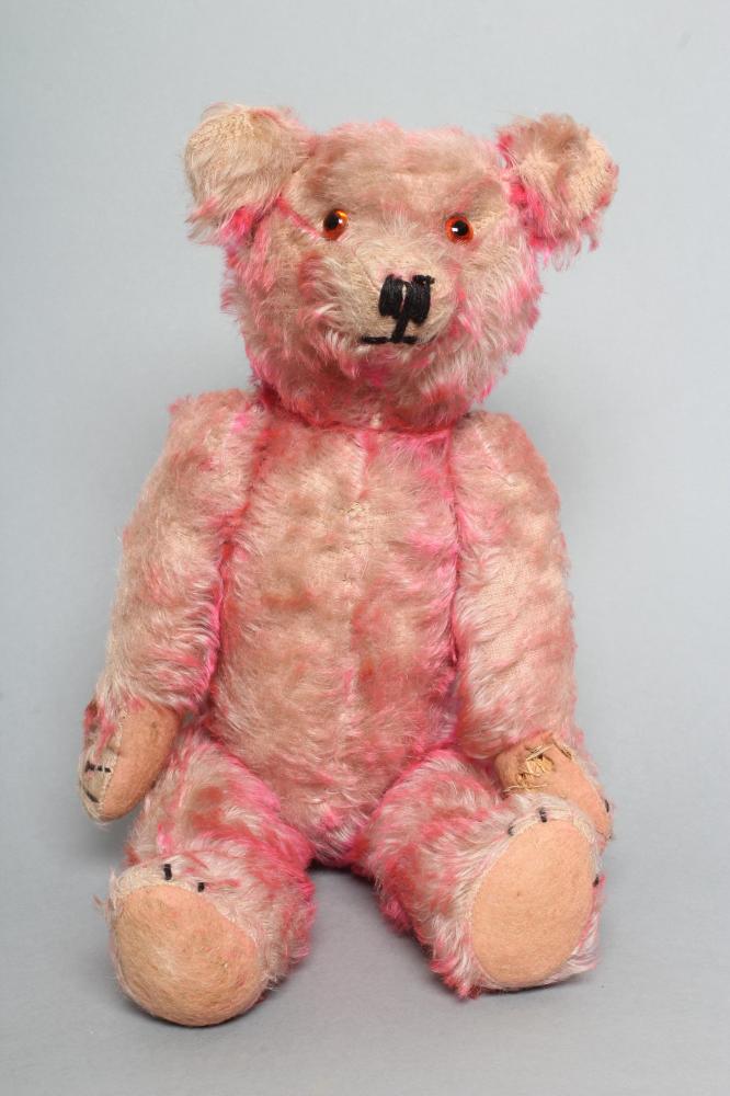 A pre-war pink musical jointed teddy bear Image