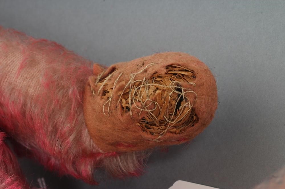 A pre-war pink musical jointed teddy bear Image