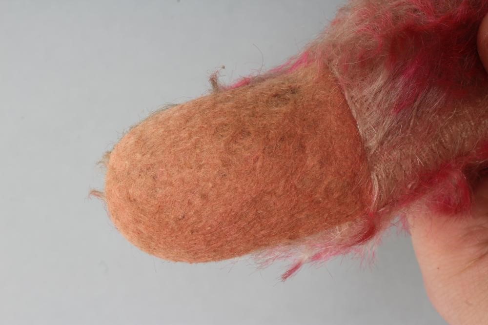 A pre-war pink musical jointed teddy bear Image