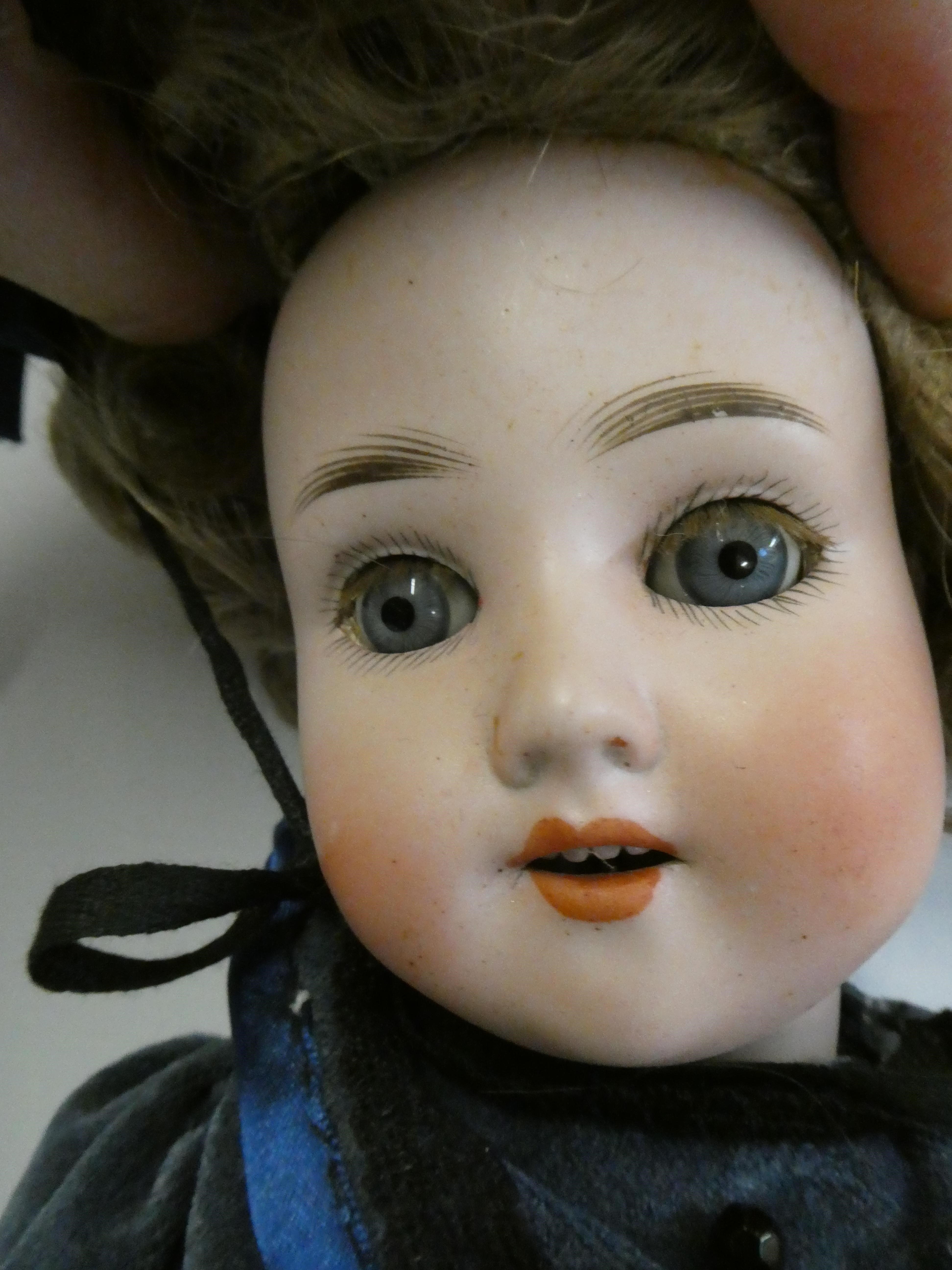 A Schoenau & Hoffmeister bisque socket head doll Image