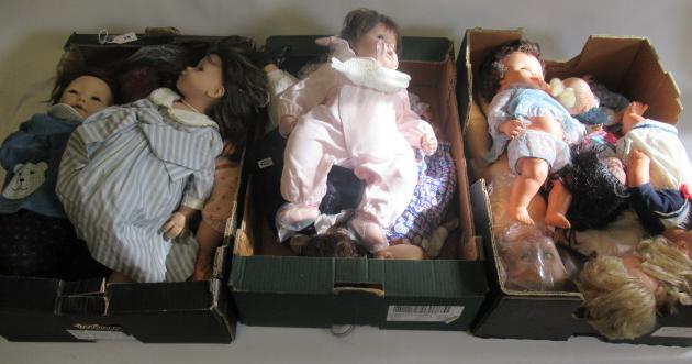 Three boxes of modern dolls Image