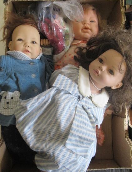 Three boxes of modern dolls Image