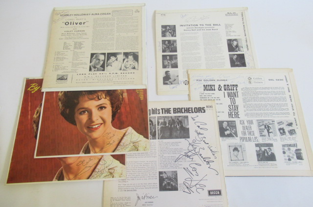 Six signed record slips Image