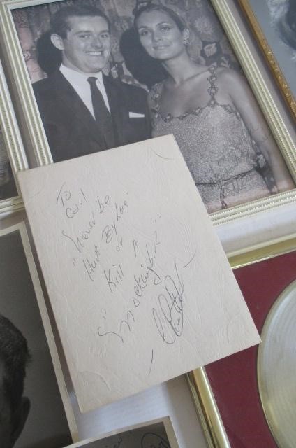 A collection of autographed photographs Image