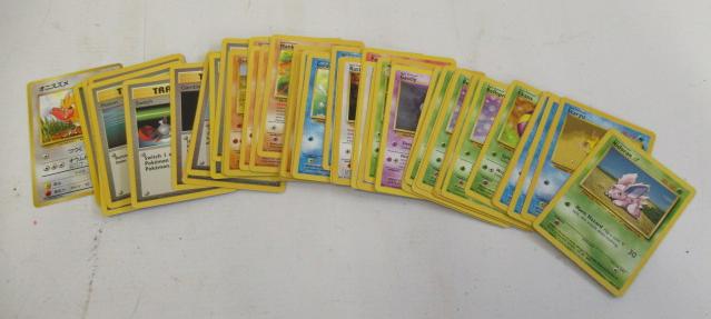 Fifty three Pokemon trading cards Image