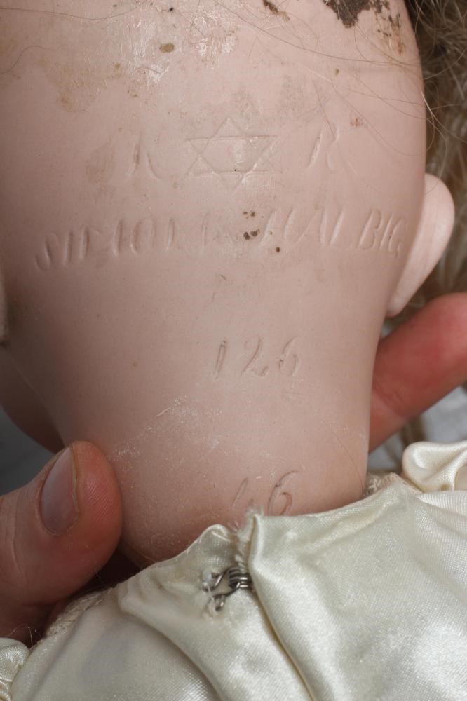 A Kammer & Reinhardt bisque socket head flirty character doll Image