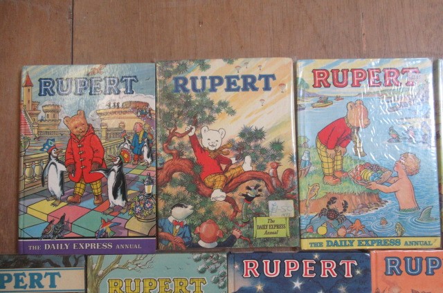 Sixteen Daily Express Rupert Annuals from 1970 Image