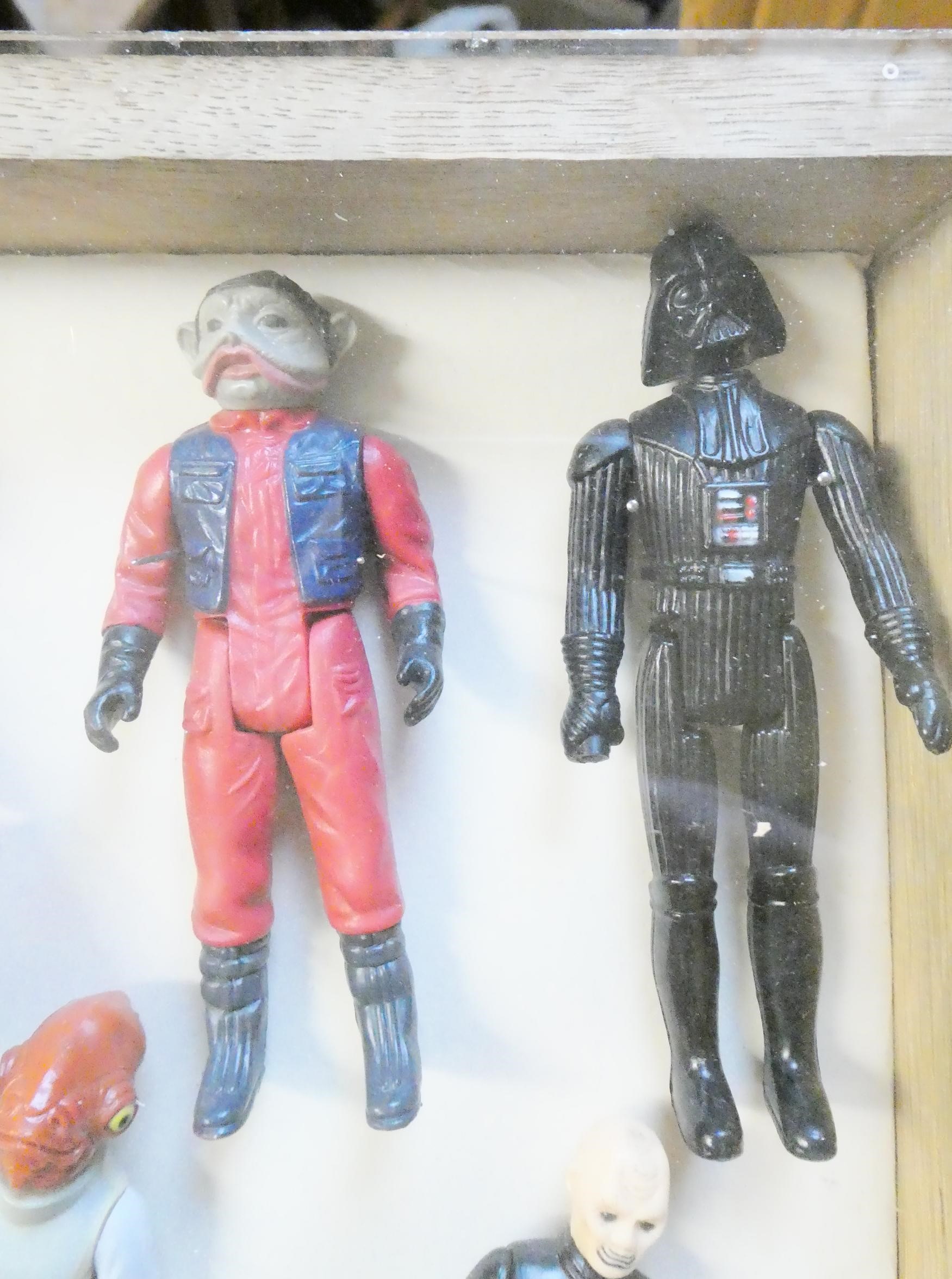 A display box containing eighteen Star Wars figures Image