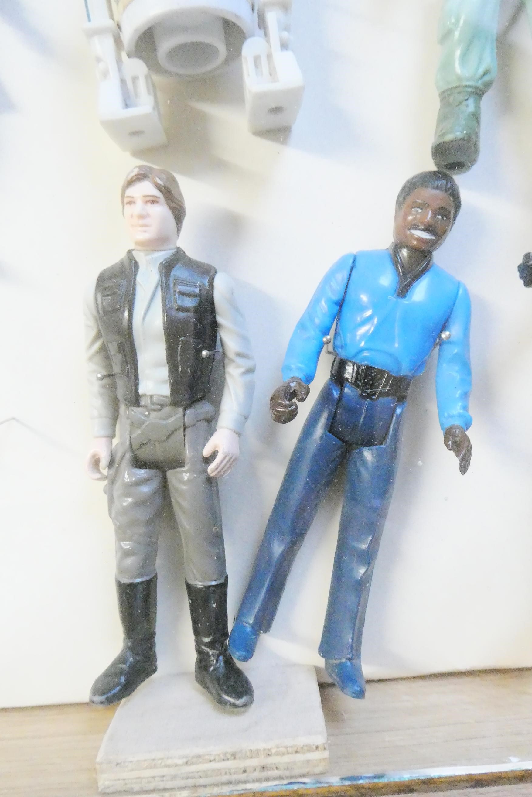 A display box containing eighteen Star Wars figures Image