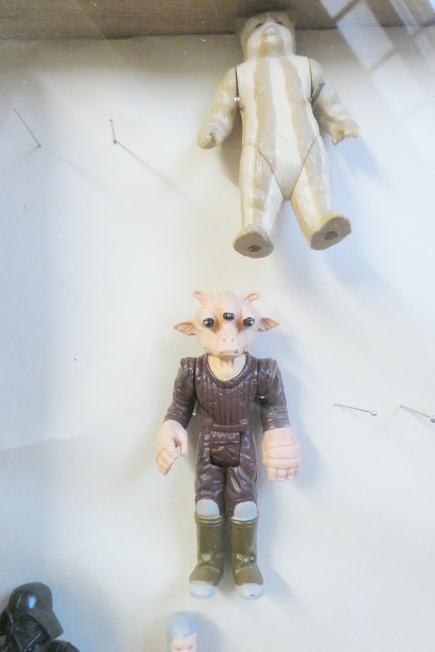 A display box containing eighteen Star Wars figures Image