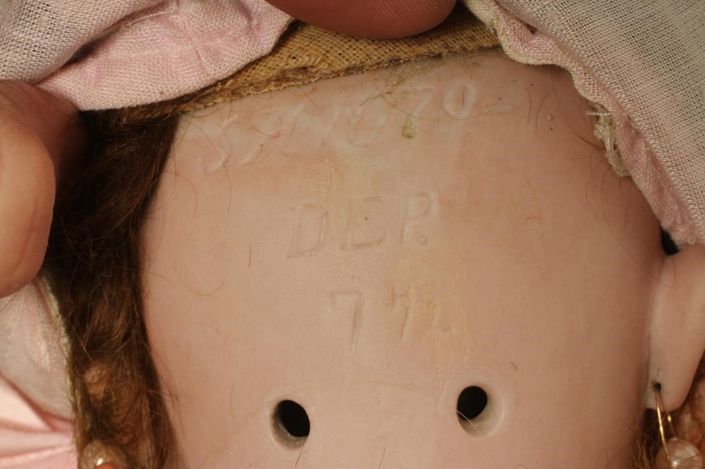 A Simon & Halbig bisque socket head doll Image