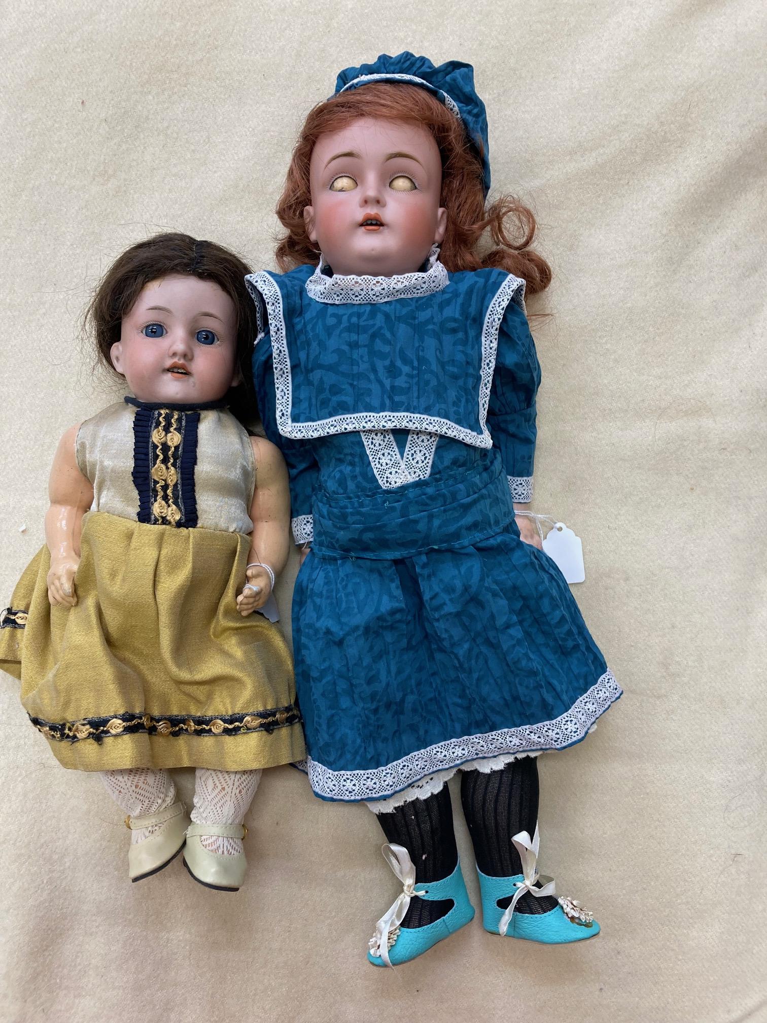 Two bisque socket head dolls, comprising a 14" doll with blue glass fixed eyes, Image