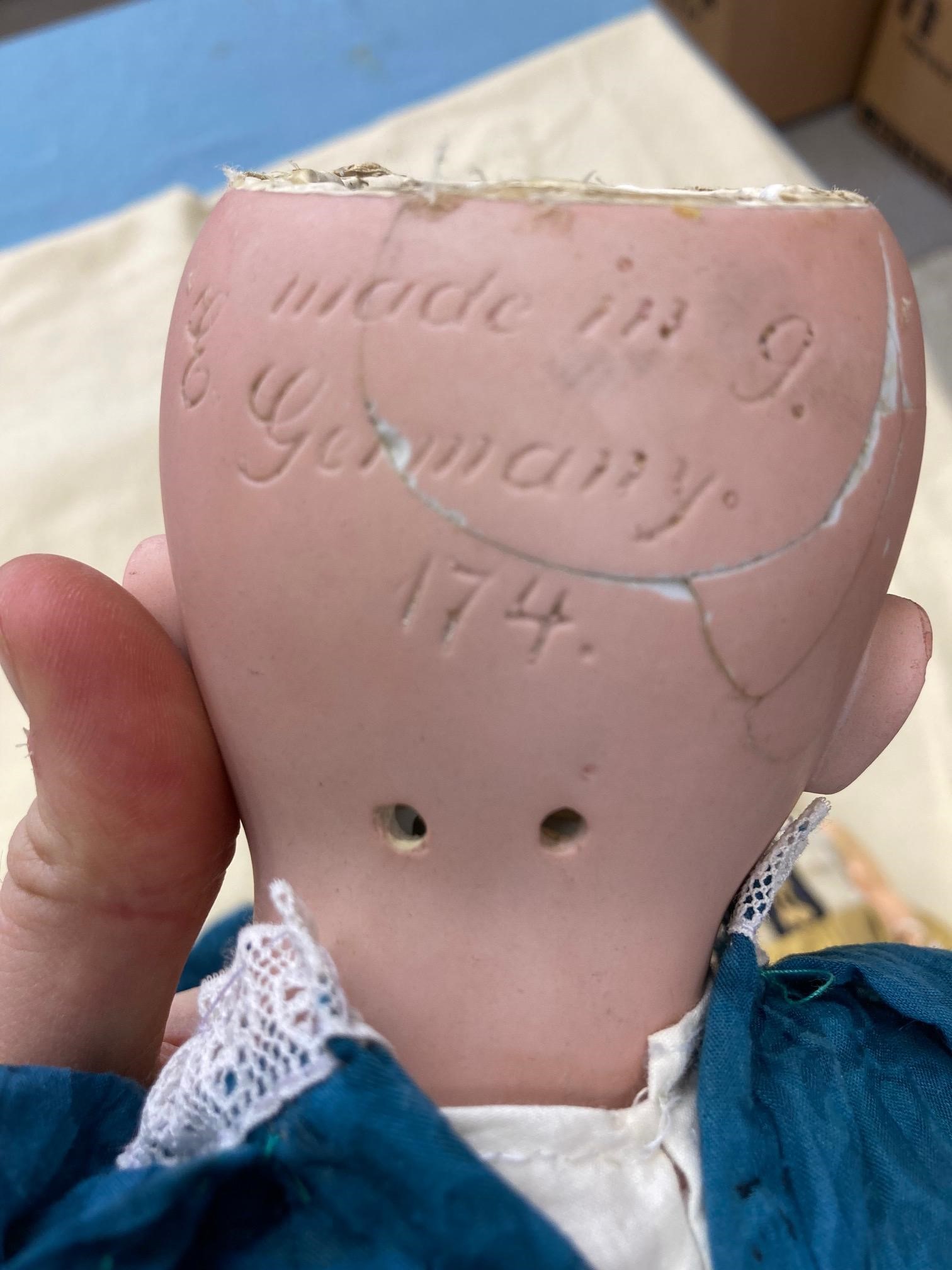 Two bisque socket head dolls, comprising a 14" doll with blue glass fixed eyes, Image