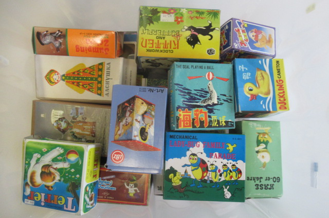 A large quantity of modern issue clockwork tin printed animals by Korean and Chinese manufacturers Image