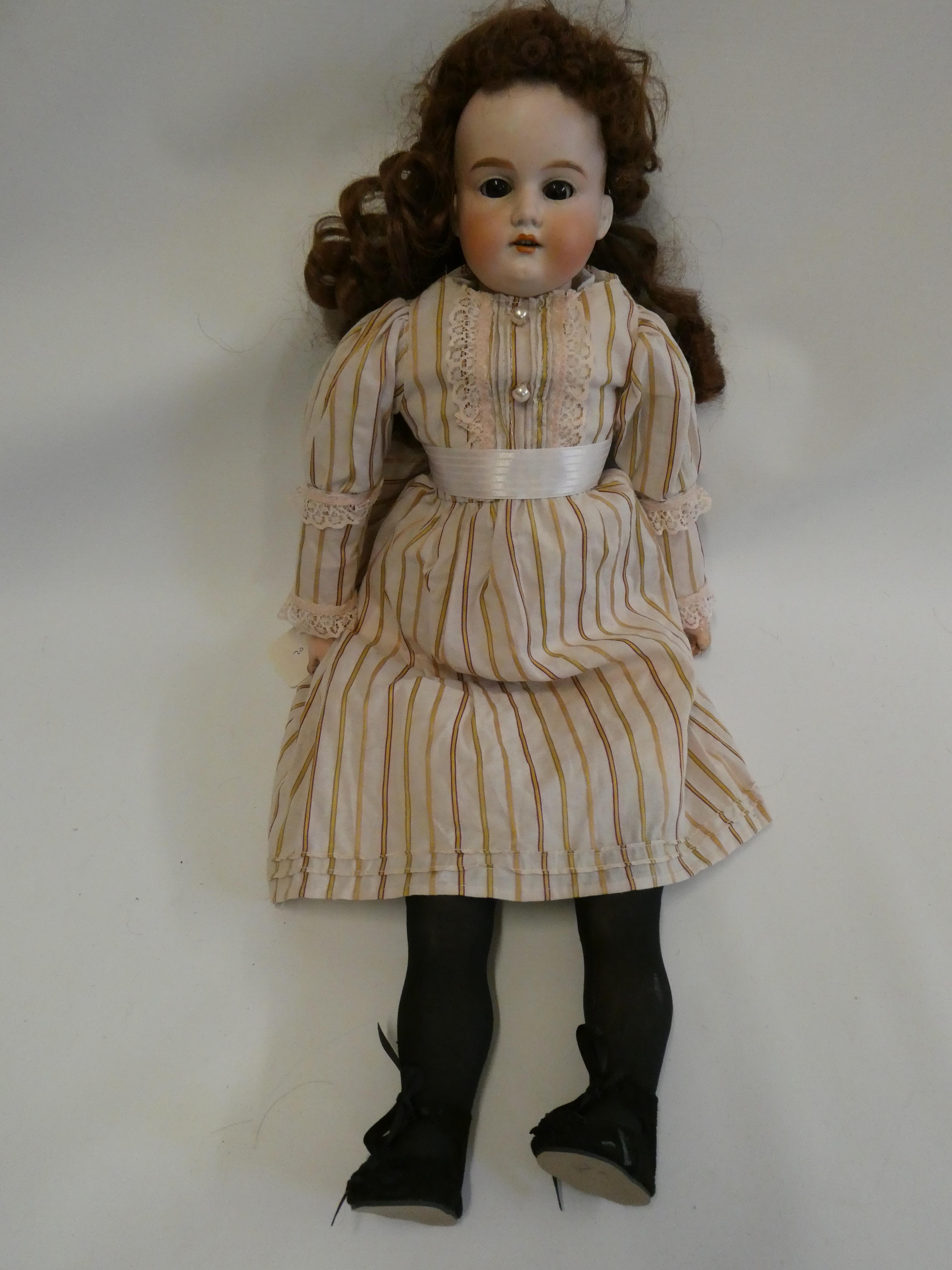 An Armand Marseille bisque shoulder head doll Image