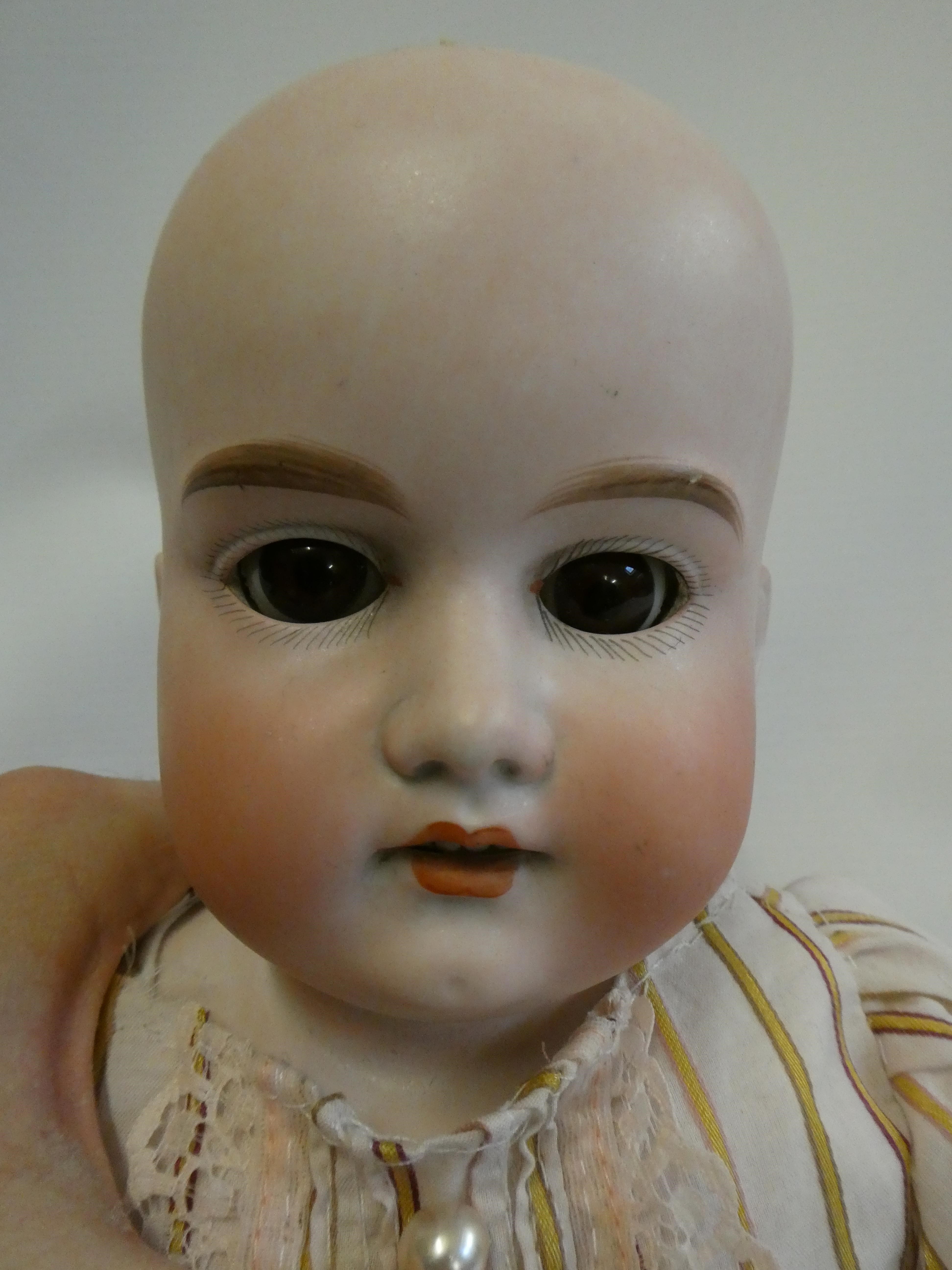 An Armand Marseille bisque shoulder head doll Image